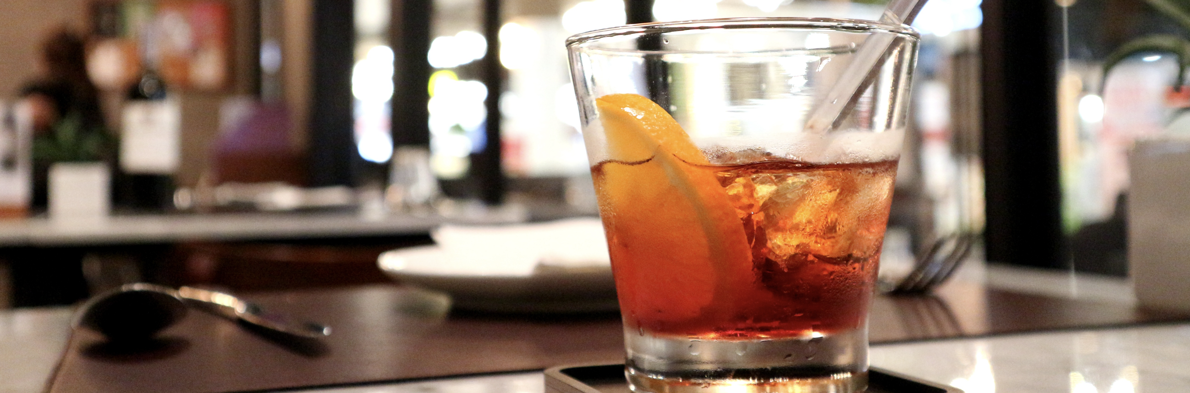 Image - half-full glass on restaurant bar