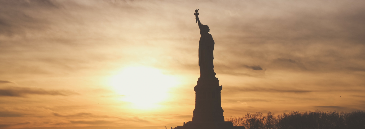 Immigrant Day of Visibility Image - the Statue of LIberty at sunset