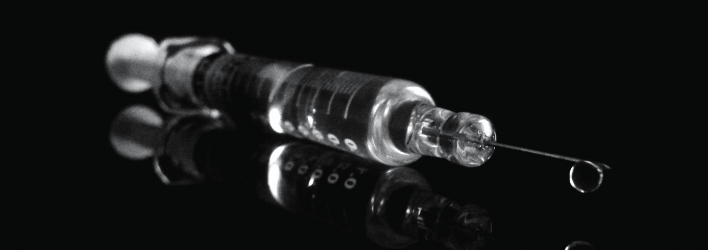 COVID-19 Vaccines and Returning to Normalcy Image - vaccine syringe