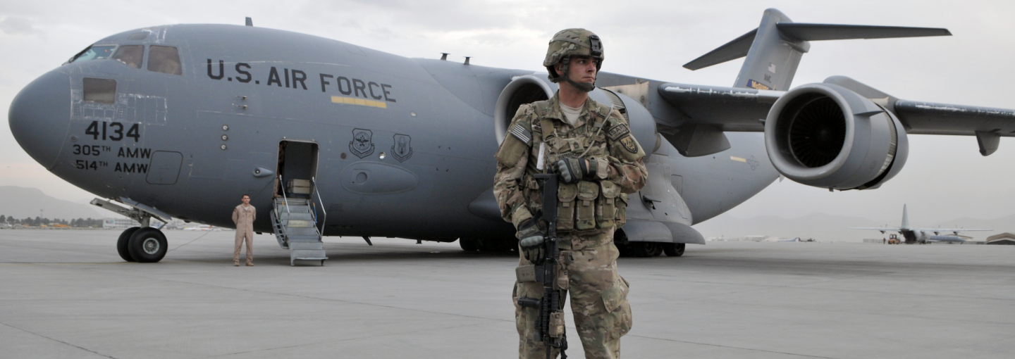 The Afghan Tragedy Image - U.S. soldier in front of Air Force plane in Afghanistan
