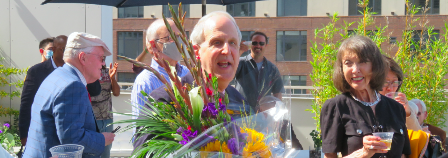 George Dobbins's Exit Interview Image - George Dobbins holding flowers