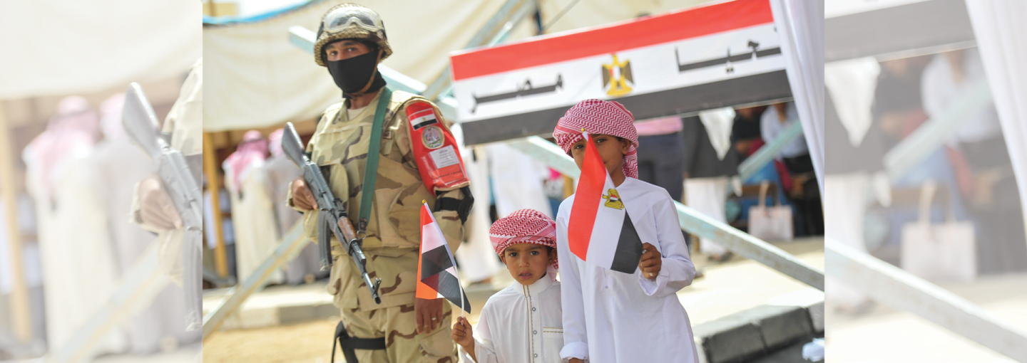The Changing Face of Authoritarian Politics in Egypt Image - soldier and two children