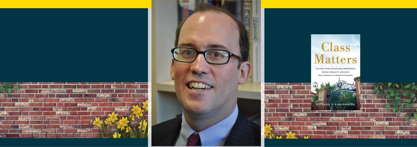 Image - the speaker, his book cover, and a brick wall