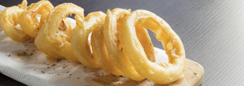 Image - a row of onion rings on a wood serving board