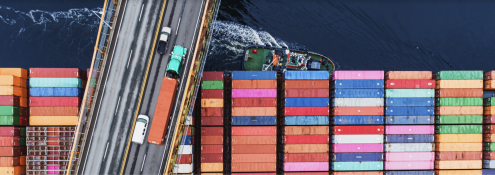 Image - shipping freighter passing underneath a bridge