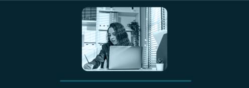 Image - woman working at desk with computer
