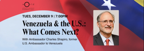 Image - the speaker and program title and detail of U.S. flag