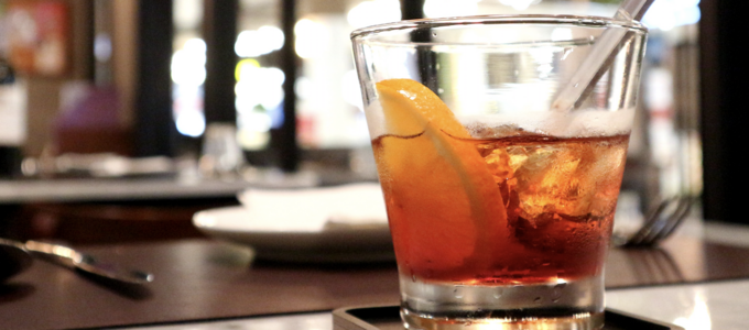 Image - half-full glass on restaurant bar