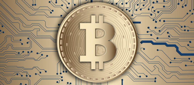 Image - Bitcoin symbol in front of computer circuitry