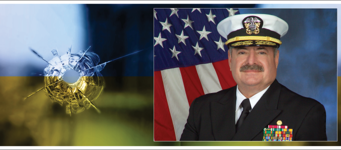 Image - the speaker and photo of bullet hole in Ukrainian flag-colored glass