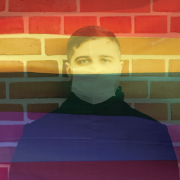 COVID-19 and the LGBTQI Community Image - man wearing surgical mask