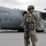 The Afghan Tragedy Image - U.S. soldier in front of Air Force plane in Afghanistan