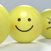 On the Road to a World Without Depression Image - balls with smiley and frowny faces