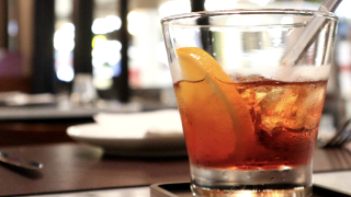 Image - half-full glass on restaurant bar