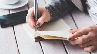 Image - woman writing in book