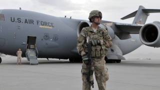 Image - U.S. soldier in front of Air Force plane in Afghanistan