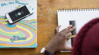 Image - student working with pencil, ruler and paper next to book and smarphone