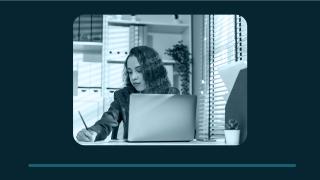 Image - woman working at desk with computer