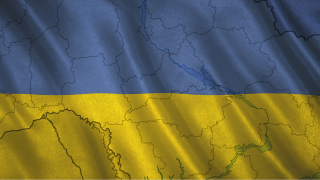 Image - outline of Ukraine against backdrop of Ukrainian flag colors