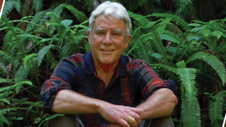 Image - photo of speaker surrounded by plants